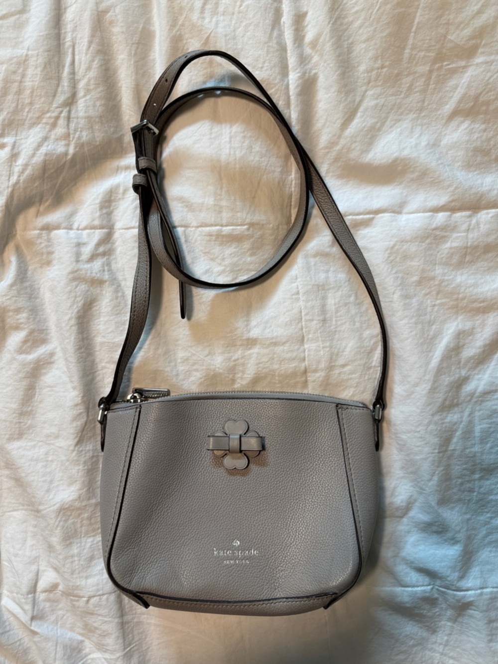kate spade gray pebbled leather crossbody with bow logo
